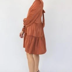 Among The Brave Fashion Deluxe Copper LS Balloon Sleeve Tie Back Tiered Mini Dress